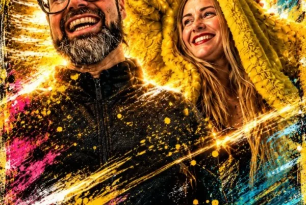 Smiling hosts in colourful splashes of paint and light, one wearing a yellow hood.
