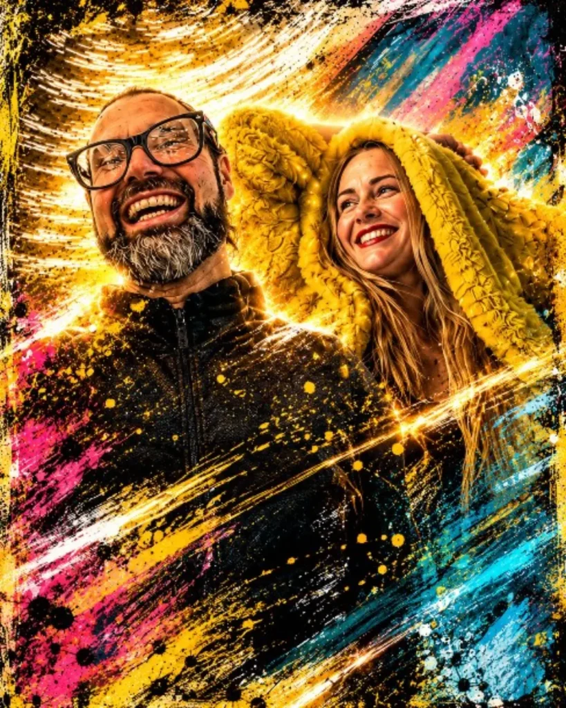 Smiling hosts in colourful splashes of paint and light, one wearing a yellow hood.