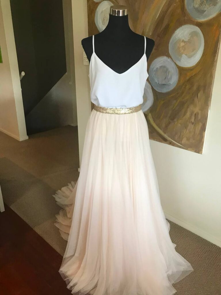 Sewciety Studio — custom formal outfit White camisole and blush tulle skirt with gold waistband displayed on a dress form
